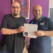 First Keighley customer Howard Flett with Brsk community manager Mohammed Amran