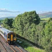 A train makes its way along the Bentham Line (photo: Charlie Rouse)