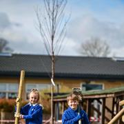 Lacey Ainshaw and Danny Webster take part in a planting day at Eastburn Junior & Infant School