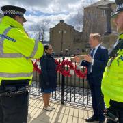 Priti Patel with police officers and MP Robbie Moore during her visit to Keighley