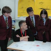 Illustrator and author Chris Mould with pupils at Holy Family School