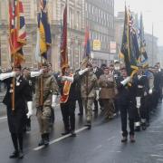 Standard bearers make their way along North Street to Keighley Shared Church