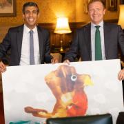 Prime Minister Rishi Sunak and MP Robbie Moore with Logan's design