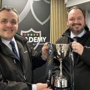 Transdev operations director Vitto Pizzuti, left, and chief executive officer Alex Hornby with the trophy