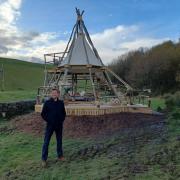George Clarke in front of the tepee