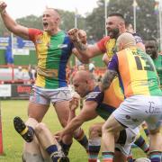 Keighley Cougars players celebrate a try against Whitehaven