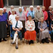 Past and present members attend a 70th-anniversary dance