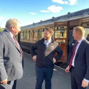 Levelling up minister Jacob Young, centre, during his visit to the railway