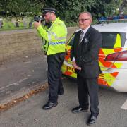 Town mayor Cllr John Kirby with police as they carry out speed checks