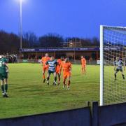 Freddie Westfall (centre) turns home Steeton's equaliser just after the hour mark, to the despair of their tangerine-shirted hosts.