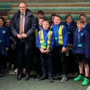 MP Julian Smith with the pupils during their visit