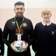 Student mentor and teaching assistant Chinny Singh with the pupils
