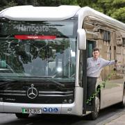 Transdev driver Brandon Hopper and one of the new electric buses, which underwent trials in Keighley and Harrogate