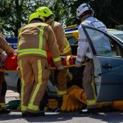 Firefighters during a demonstration of how they rescue crash casualties