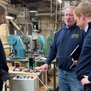 MP Robbie Moore, right, during his visit to George Emmott (Pawsons) Ltd