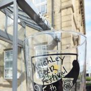This year's beer festival souvenir glass, sponsored by Timothy Taylor’s brewery