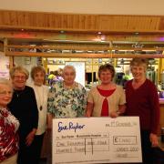 Ladies 2000 committee members with their cheque for Manorlands