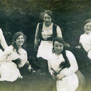 FIVE bonny lasses recline on a heathery hillside in an old mystery photograph supplied by Mrs Maureen Jackson, of Fell Lane, Keighley