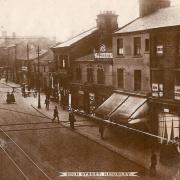 THE variegated individual premises of High Street, seen here before 1924 and the demise of Keighley's trams, remain reasonably identifiable to the present day but the end building projecting from Bridge Street was to necessitate future demolition as