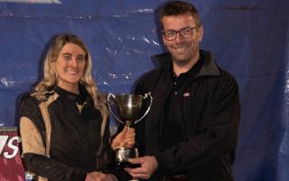 Two-time one-car series champion Phoebe Wainman-Hawkins, from Silsden, is presented with her title-winning trophy at Odsal at the weekend. Picture: Ian Bannister.