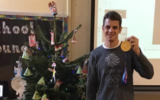 Jonny Brownlee at Holycroft Primary School, with one of his medals