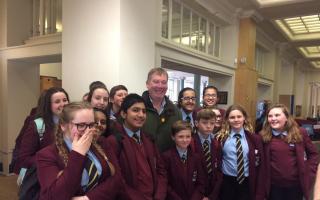 Keighley MP Kris Hopkins with Holy Family School students who created an anti-drugs display in Keighley Library