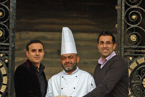 Bradford celebrates success in the Curry Capital contest for the fourth year running, from left, Iftikhar Hussain of Shimla Spice with Ejaz Hussain and Harry Khinda, of Zaara's